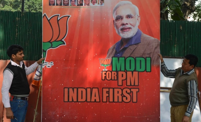 workers erect a billboard bearing the portrait of india 039 s opposition bharatiya janata party bjp prime ministerial candidate narendra modi in new delhi photo afp workers erect a billboard bearing the portrait of india 039 s opposition bharatiya janata party bjp prime ministerial candidate narendra modi in new delhi photo afp