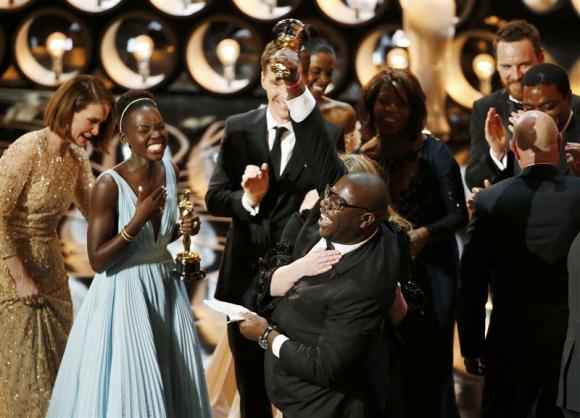 director and producer steve mcqueen r celebrates after accepting the oscar for best picture with lupita nyong 039 o l at the 86th academy awards in hollywood california march 2 2014 photo reuters