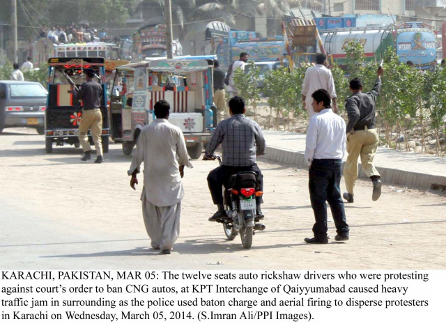 police officials chase drivers of the six and nine seater qingqi rickshaws during their protest on wednesday photo ppi police officials chase drivers of the six and nine seater qingqi rickshaws during their protest on wednesday photo ppi