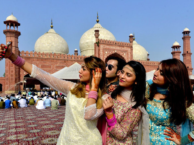 a group of youngsters pose for selfie outside badshahi mosque after attending eid prayers in lahore on september 13 2016 photo afp a group of youngsters pose for selfie outside badshahi mosque after attending eid prayers in lahore on september 13 2016 photo afp