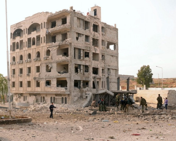 file photo of syrian security forces inspecting damages caused by a car bomb blast in the northern city of aleppo photo afp file photo of syrian security forces inspecting damages caused by a car bomb blast in the northern city of aleppo photo afp