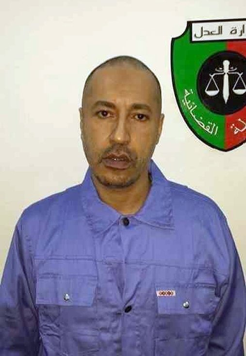 a photo released by the libyan prison authority on march 6 2014 shows saadi gaddafi after having his head and beard shaved following his extradition from niger to tripoli photo afp