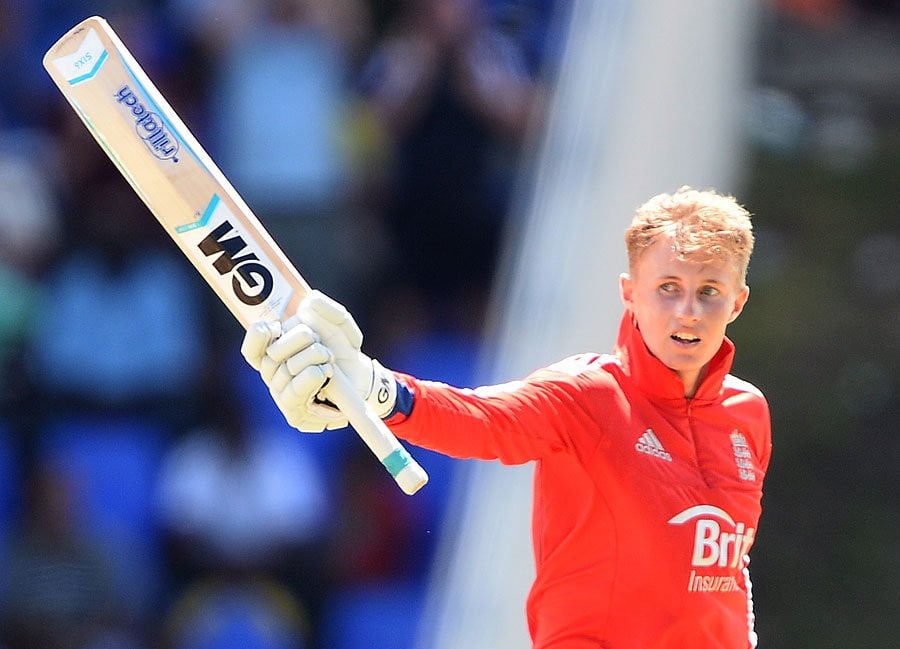 joe root battled through the considerable pain of a sore right thumb the result of a blow inflicted by fast medium bowler ravi rampaul at the start of his innings to stroke his first hundred in this form of the game photo afp