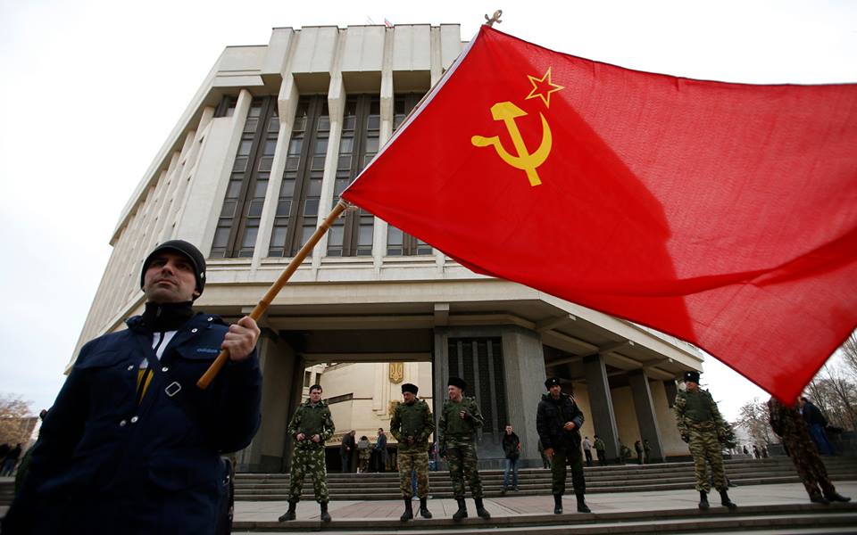 a man holds a soviet union flag as he attends a pro russian rally at the crimean parliament building in simferopol march 6 2014 photo reuters