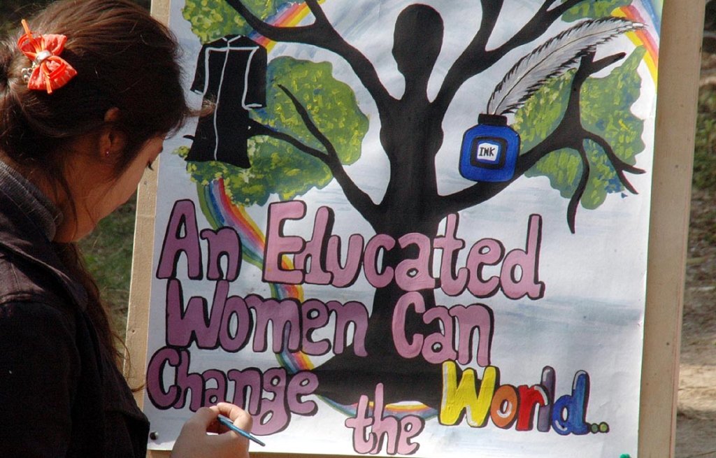 a student paints a chart at waqar un nisa college on the occasion of international women s day photo nni