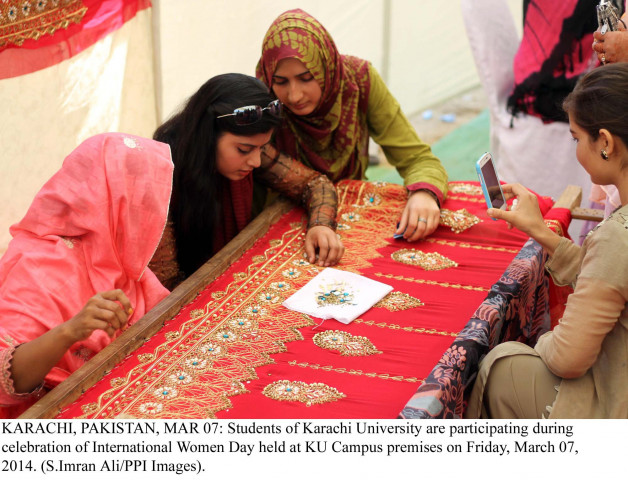 students see how women workers embroidery clothes during a demonstration in karachi university photo ppi students see how women workers embroidery clothes during a demonstration in karachi university photo ppi
