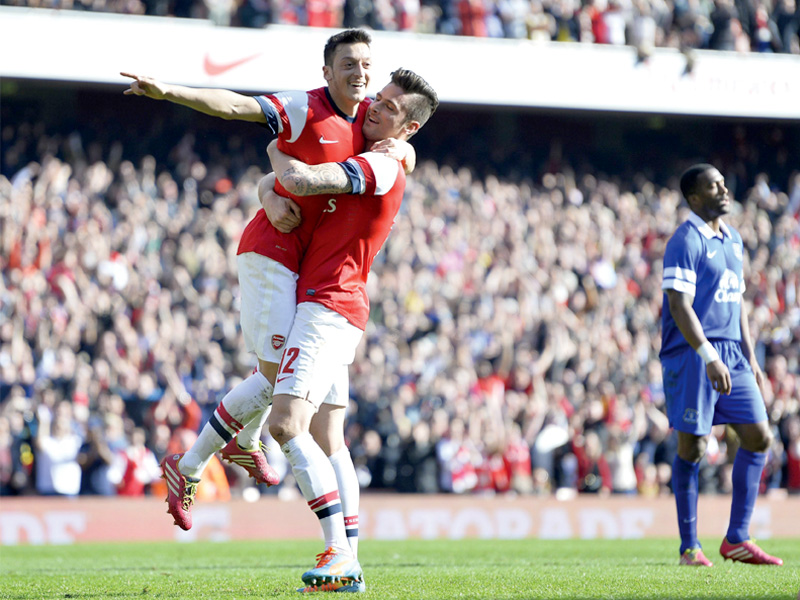 both giroud and ozil had come for some stick in recent matches but silenced their critics with strong performances against everton photo afp