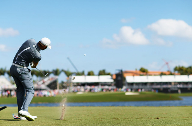 dustin johnson hits his tee shot on the ninth hole during the second round of the world golf championships cadillac championship at trump national doral on march 7 2014 in doral florida photo afp dustin johnson hits his tee shot on the ninth hole during the second round of the world golf championships cadillac championship at trump national doral on march 7 2014 in doral florida photo afp