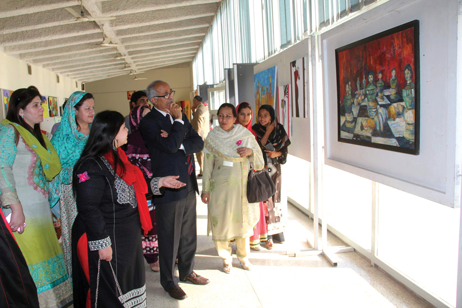 the uaf vice chancellor looks at paintings displayed at a cultural show on the occasion photo express