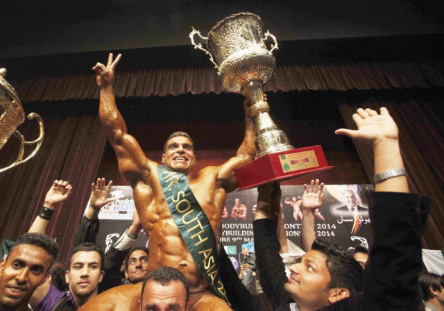 muhammad shahzad holds his mr south asia trophy pakistan won the punjab youth festival body building contest afghanistan was second and nepal was third photo shafiq malik express muhammad shahzad holds his mr south asia trophy pakistan won the punjab youth festival body building contest afghanistan was second and nepal was third photo shafiq malik express