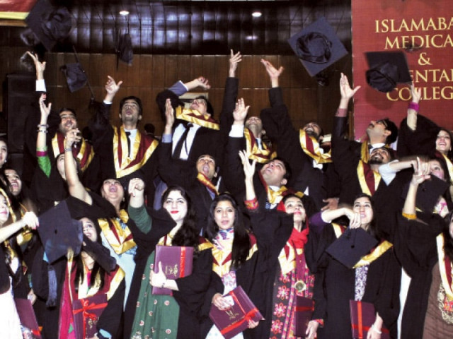 graduates throwing their caps in the air after receiving their degrees on tuesday photo express graduates throwing their caps in the air after receiving their degrees on tuesday photo express
