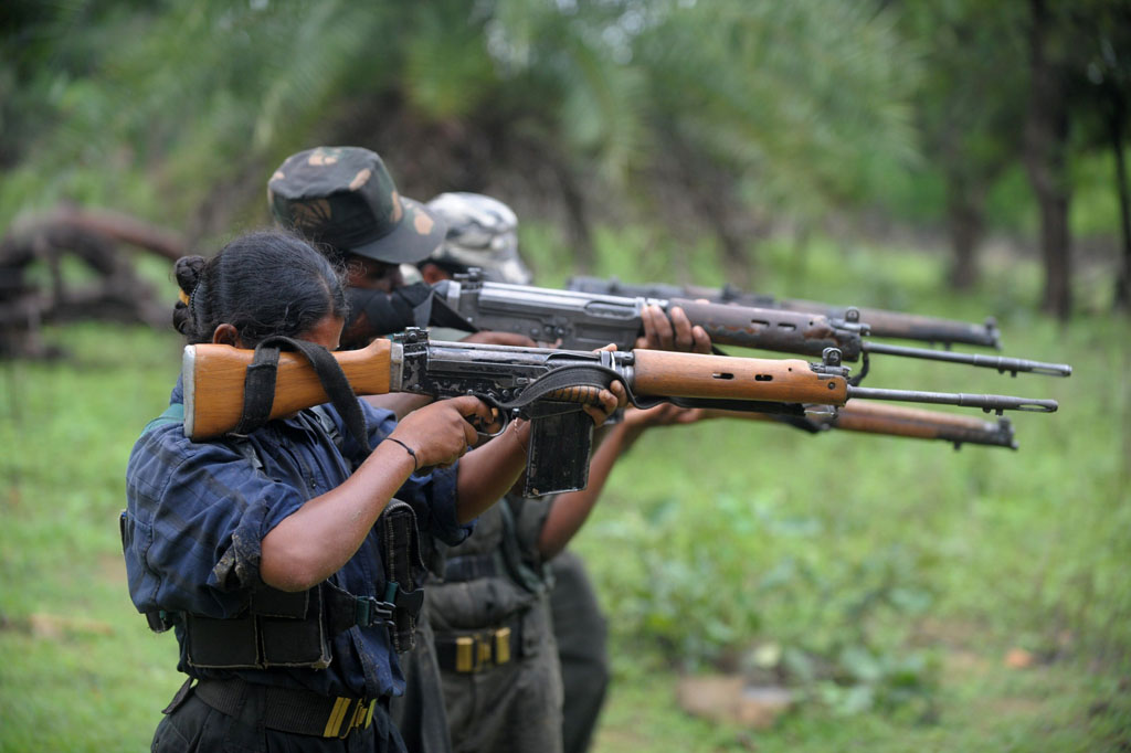 in this photograph taken on july 8 2012 indian maoists ready their weapons as they take part in a training camp in a forested area of bijapur district in the central indian state of chhattisgarh photo afp file