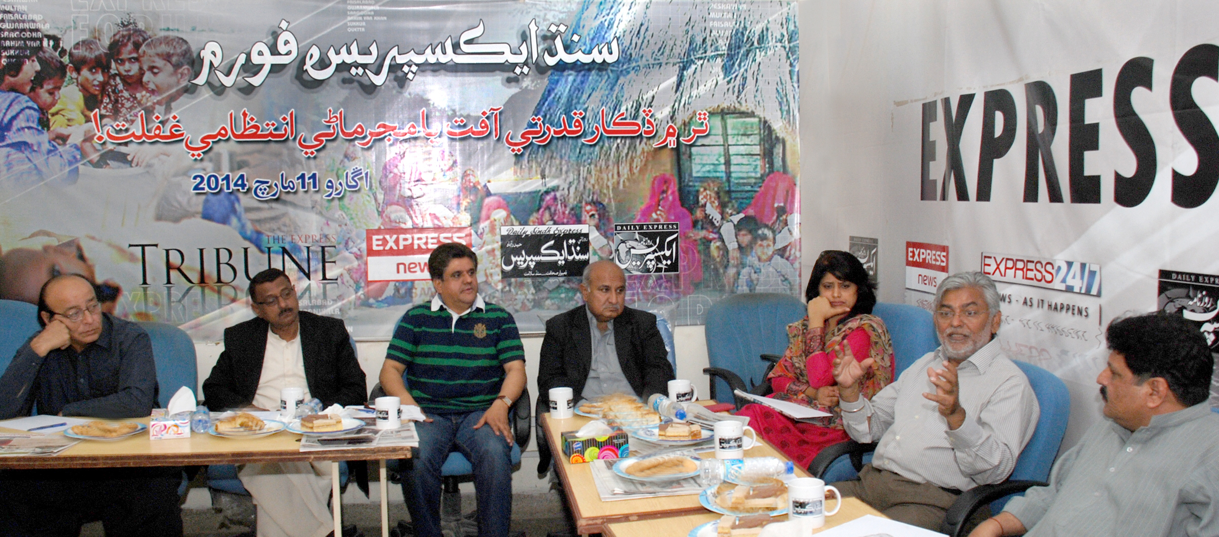 speakers at express news forum discussing the cataclysm in thar photo express