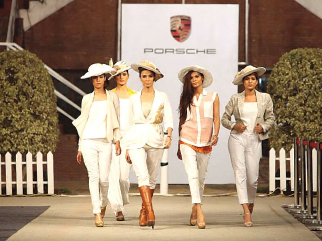 the porche team posing for the camera after putting up a successful fashion savvy polo event photo publicity the porche team posing for the camera after putting up a successful fashion savvy polo event photo publicity