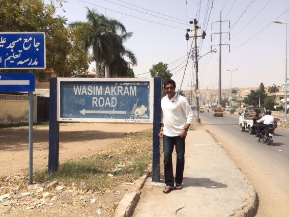 wasim akram standing next to a street sign of a road named after him photo twitter com wasimakramlive