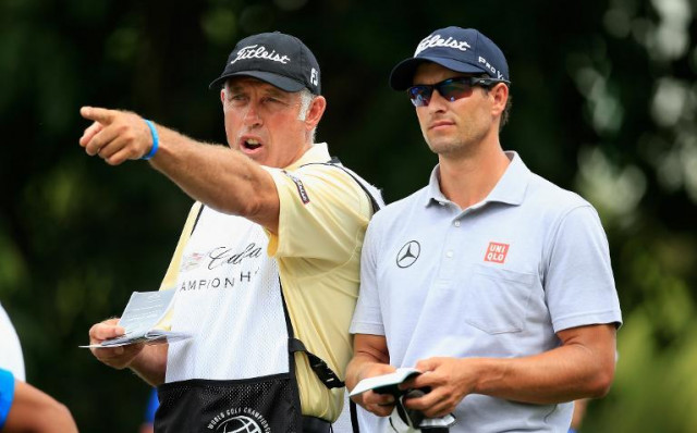 adam scott of australia lines up a shot with his caddie steve williams during the first round of the world golf championships cadillac championship at trump national doral on march 6 2014 in doral florida photo afp adam scott of australia lines up a shot with his caddie steve williams during the first round of the world golf championships cadillac championship at trump national doral on march 6 2014 in doral florida photo afp