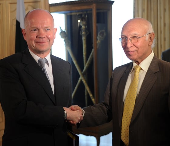 sartaj aziz r pakistan 039 s adviser for national security and foreign affairs shakes hands with british foreign secretary william hague at the foreign ministry in islamabad on july 17 2013 photo afp file