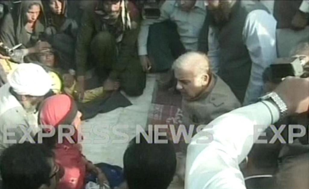 express news screengrab of punjab chief minister shahbaz sharif visiting the family of the rape victim who set herself on fire in muzaffargarh