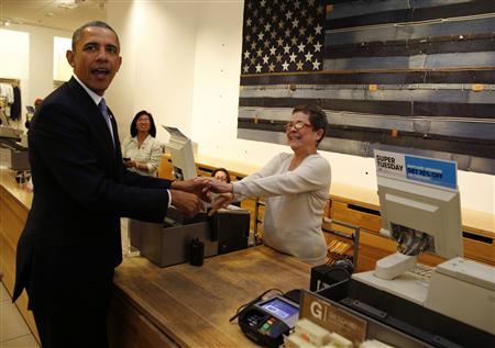 obama greets the cashier at a gap store in nyc photo reuters