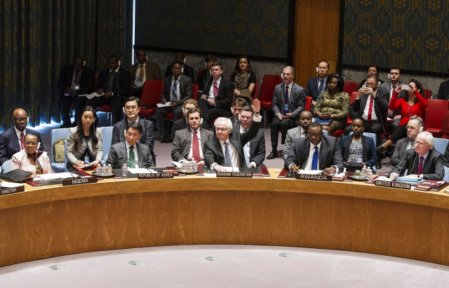 russian ambassador to the un vitaly churkin c vetoes a resolution on ukraine during a un security council emergency meeting at united nations headquarters in new york on march 15 2014 photo afp russian ambassador to the un vitaly churkin c vetoes a resolution on ukraine during a un security council emergency meeting at united nations headquarters in new york on march 15 2014 photo afp