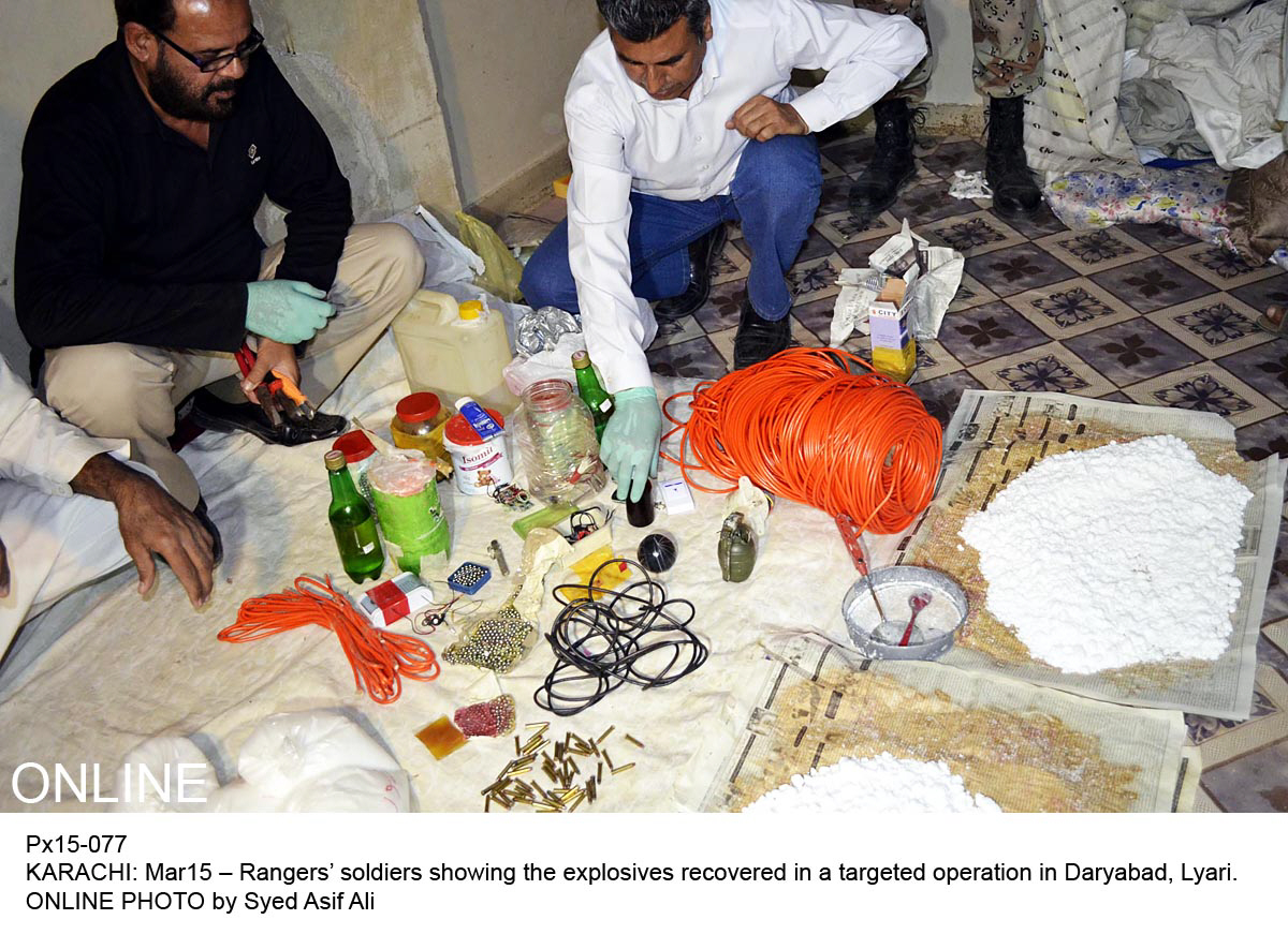 officials display the bomb making equipment that they recovered during their raids on saturday photo online