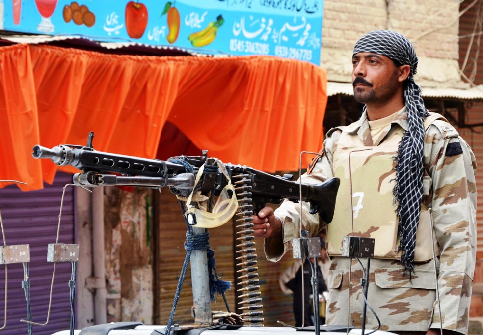 a security officer on duty in larkana photo online