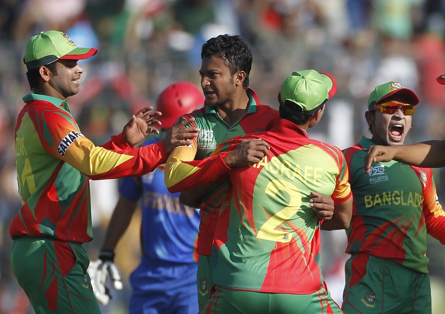 bangladesh 039 s shakib al hasan reacts as other fielders congratulate him after dismissing afghanistan 039 s najeeb tarakai successfully during their icc twenty20 world cup match at the sher e bangla national cricket stadium in dhaka march 16 2014 photo reuters
