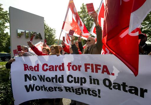 members of building and wood workers 039 international bwi and swiss unia unions protest on october 3 2013 to support the rights of workers constructing stadiums for 2022 world cup host qatar photo afp