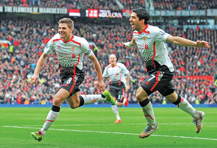 gerrard found the net twice in both sides of half time before luis suarez added a third goal in the 84th minute to give liverpool their first victory at old trafford in five years photo afp