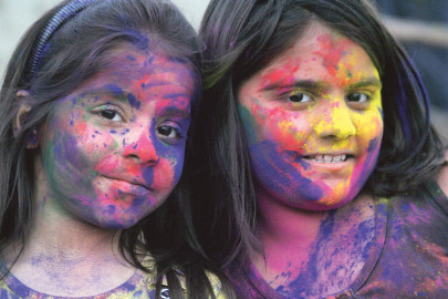 coloured up muslims and christians join holi celebrations