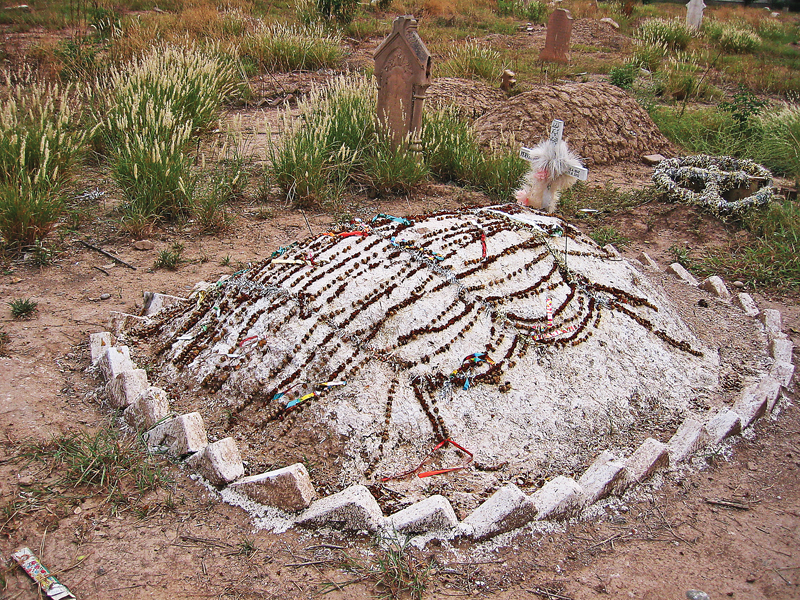 one of the relatively new graves in the cemetery photos riaz ahmad