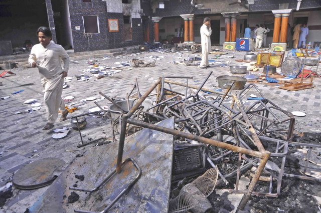 community members inspect the damage at the hindu temple in larkana photo reuters community members inspect the damage at the hindu temple in larkana photo reuters
