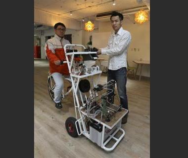 kamm kai yu r a co founder of boutique design studio fabraft displays a bicycle with a 3d printer installed in front in taipei march 13 2014 photo reuters