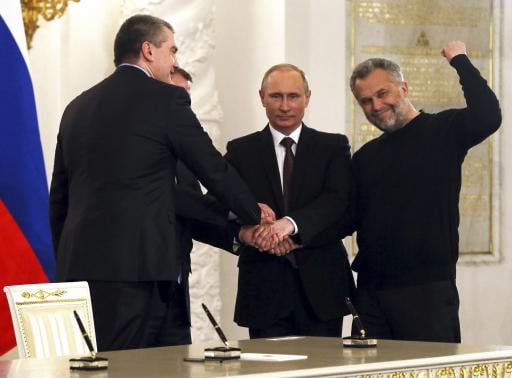 russian president putin crimea 039 s pm aksyonov crimean parliamentary speaker konstantinov and sevastopol mayor chaliy shake hands after a signing ceremony in moscow photo reuters