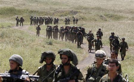 file photo of israeli soldiers walking together during a training close to the ceasefire line between israel and syria on the israeli occupied golan heights photo reuters