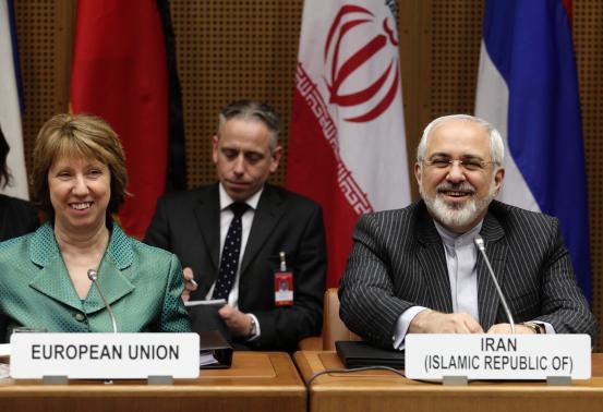 european union foreign policy chief catherine ashton l and iranian foreign minister mohammad javad zarif smile at the start of a conference in vienna march 18 2014 photo reuters