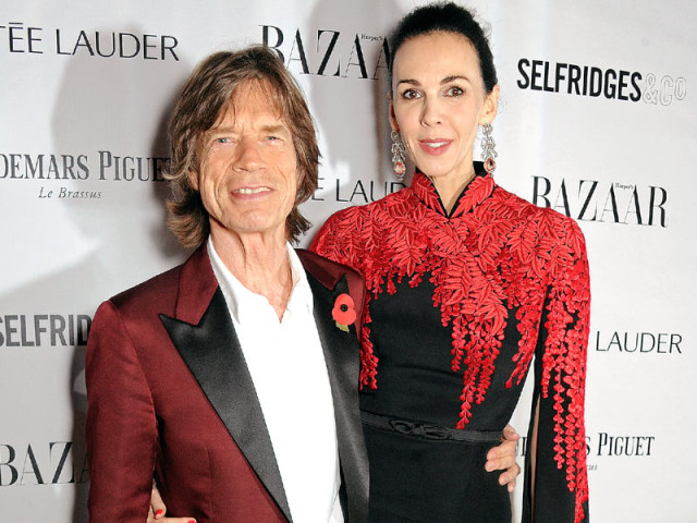 scott and jagger were often seen at celebrity events with the six foot three inch tall former model towering over her rock star boyfriend photo file scott and jagger were often seen at celebrity events with the six foot three inch tall former model towering over her rock star boyfriend photo file