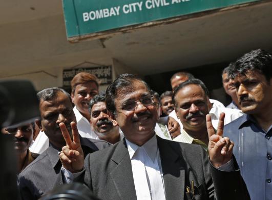 prosecution lawyer ujjwal nikam gestures after four men were found guilty of the gang rape of a photojournalist outside a court in mumbai march 20 2014 photo reuters