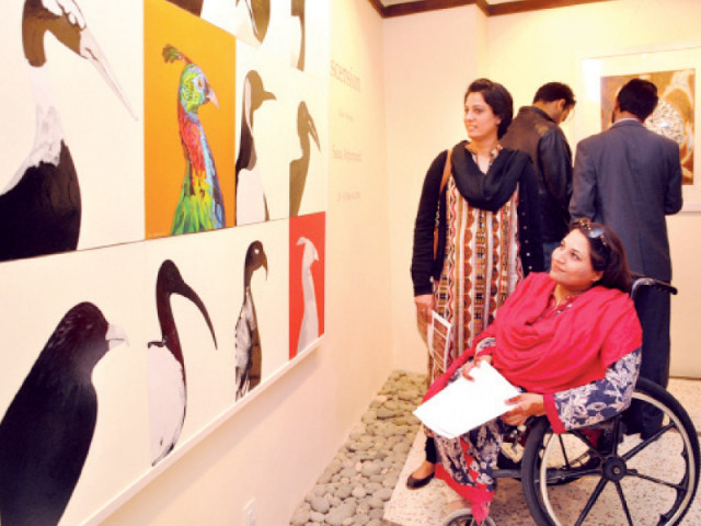 art lovers look at artwork on display at khaas gallery photo express art lovers look at artwork on display at khaas gallery photo express