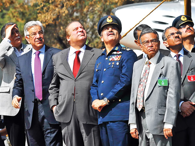 prime minister nawaz sharif and other dignitaries watching a flypast by paf jets in mianwali photo app prime minister nawaz sharif and other dignitaries watching a flypast by paf jets in mianwali photo app