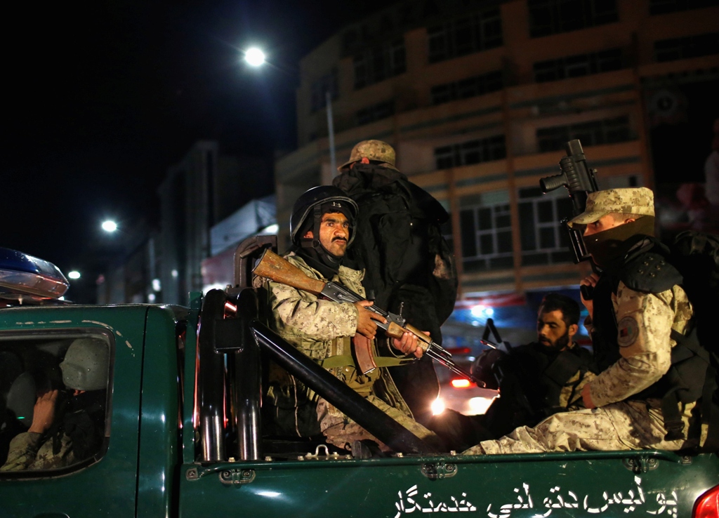 afghan security personnel arrive near the serena hotel during an attack in kabul march 20 2014 photo reuters