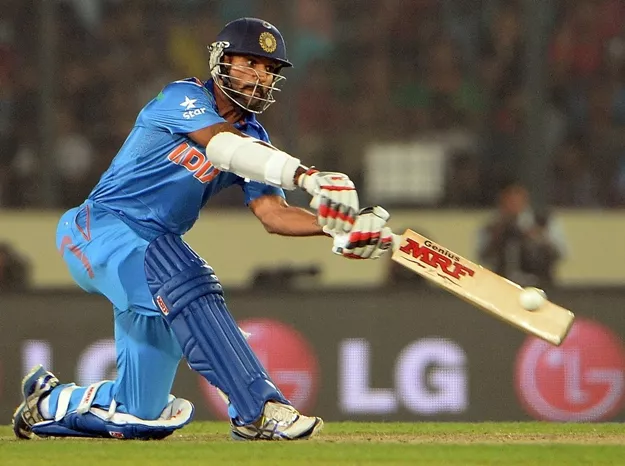 indian batsman shikhar dhawan plays a shot during the icc world twenty20 tournament cricket match between india and pakistan at the sher e bangla national cricket stadium in dhaka on march 21 2014 photo afp indian batsman shikhar dhawan plays a shot during the icc world twenty20 tournament cricket match between india and pakistan at the sher e bangla national cricket stadium in dhaka on march 21 2014 photo afp