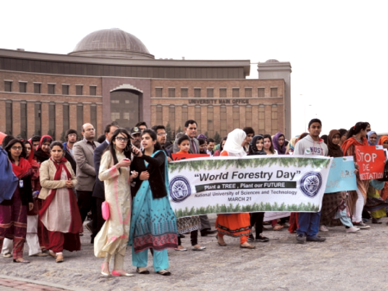 nust students and faculty members march on the campus to mark world forest day photo express