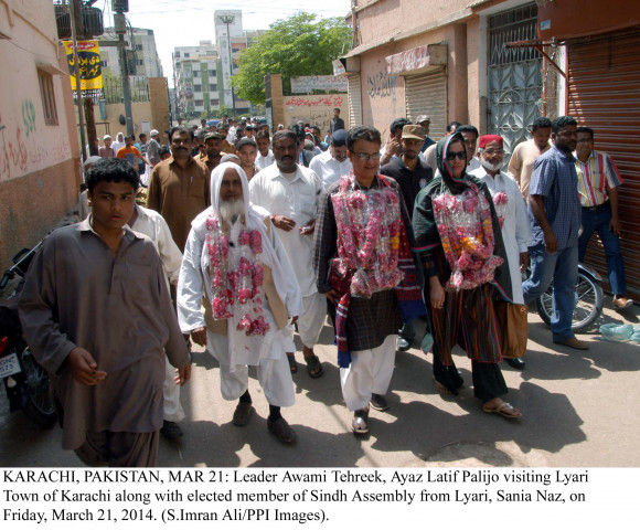 awami tehreek chief ayaz latif palijo c and mpa sania naz r walk through the streets of lyari on friday photo ppi awami tehreek chief ayaz latif palijo c and mpa sania naz r walk through the streets of lyari on friday photo ppi