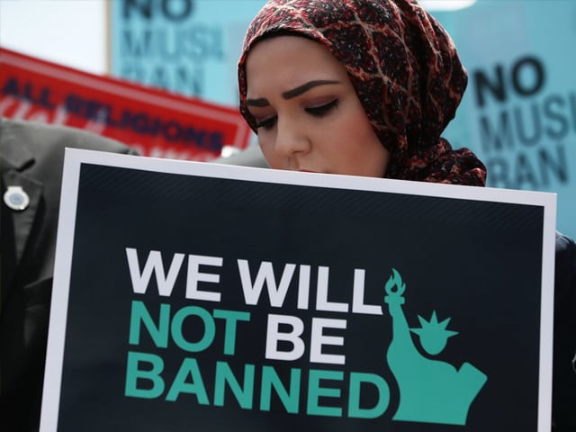a women participates in demonstration against u s president trump 039 s travel ban as protesters gather outside the u s supreme court following a court issued immigration ruling june 26 2018 in washington dc photo getty