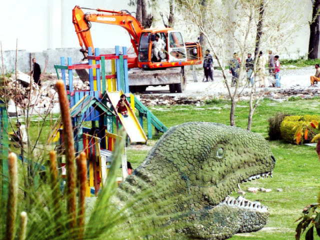 a park being demolished for metro bus project near liaquat bagh photo online a park being demolished for metro bus project near liaquat bagh photo online