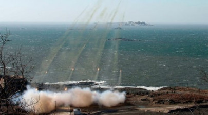 n korea test fires 30 missiles into sea s korean military