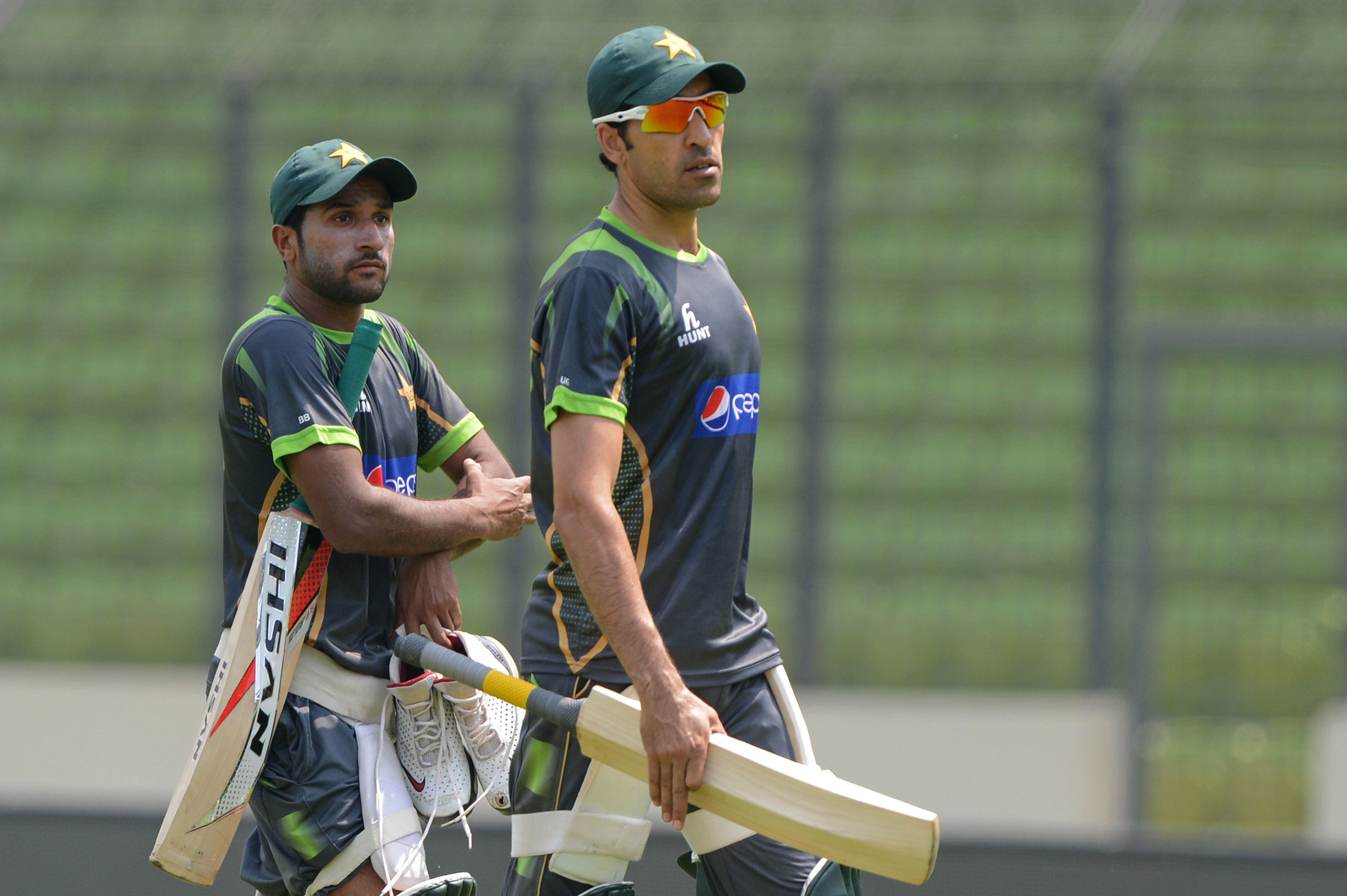 umar gul and bilawal bhatti walk off the field during a practice session at the sher e bangla national cricket stadium in dhaka on saturday pakistan plays australia on march 23 in the icc world twenty20 cricket tournament photo afp