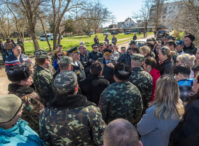 major general of the naval aviation of the russian black sea fleet igor kozhyn c speaks to ukrainian pilots and their wives at the fedorovka airbase in the saki district of crimea on march 22 2014 photo afp major general of the naval aviation of the russian black sea fleet igor kozhyn c speaks to ukrainian pilots and their wives at the fedorovka airbase in the saki district of crimea on march 22 2014 photo afp