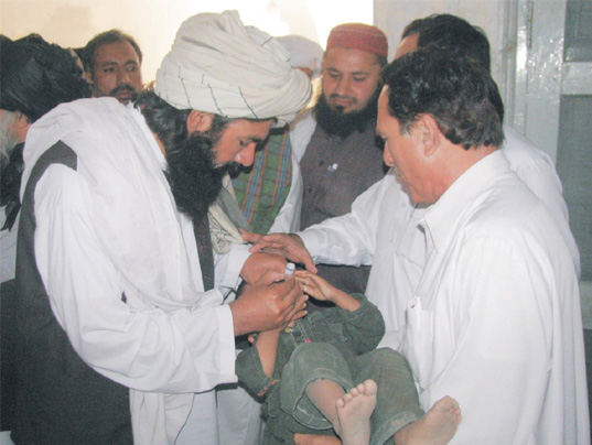 a child in bannu is being vaccinated for polio in khyber pakhtunkhwa one of the high risk areas for the disease is swat photo inp